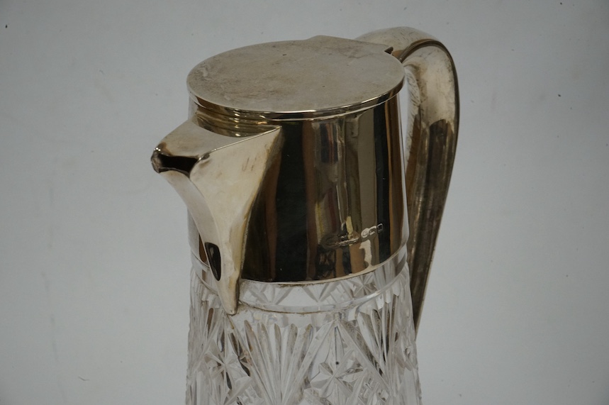 A George V silver mounted cut glass claret jug, Birmingham, 1911, height 25.3cm, Condition - poor to fair